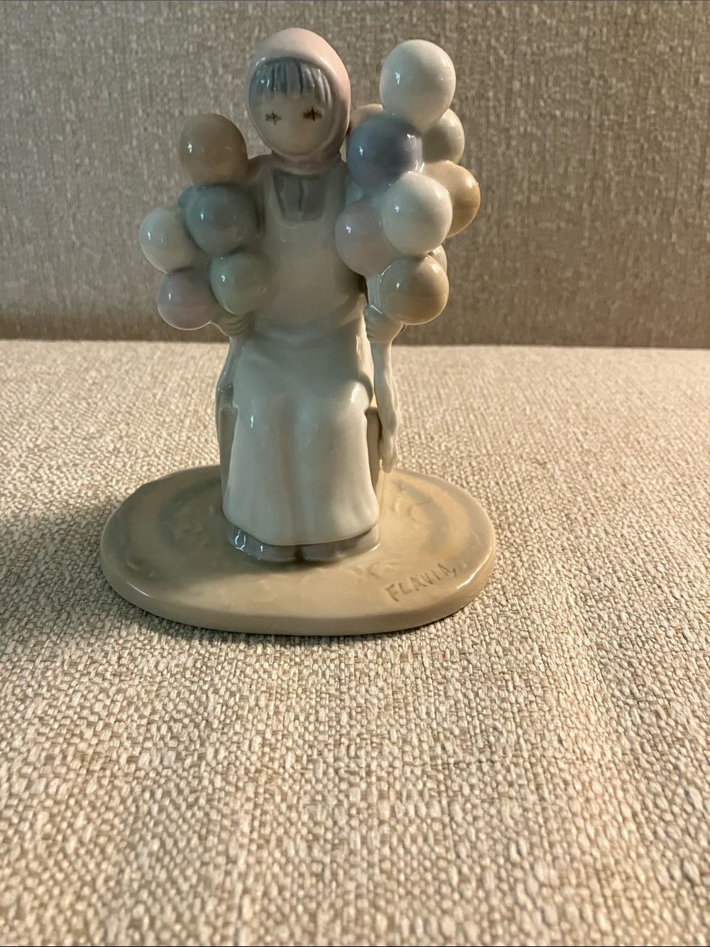 Glazed Porcelain Girl Figurine with Pastel Balloons - Cream and Pastel Hues